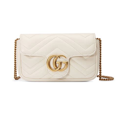 gucci gold headpiece|white Gucci bag.